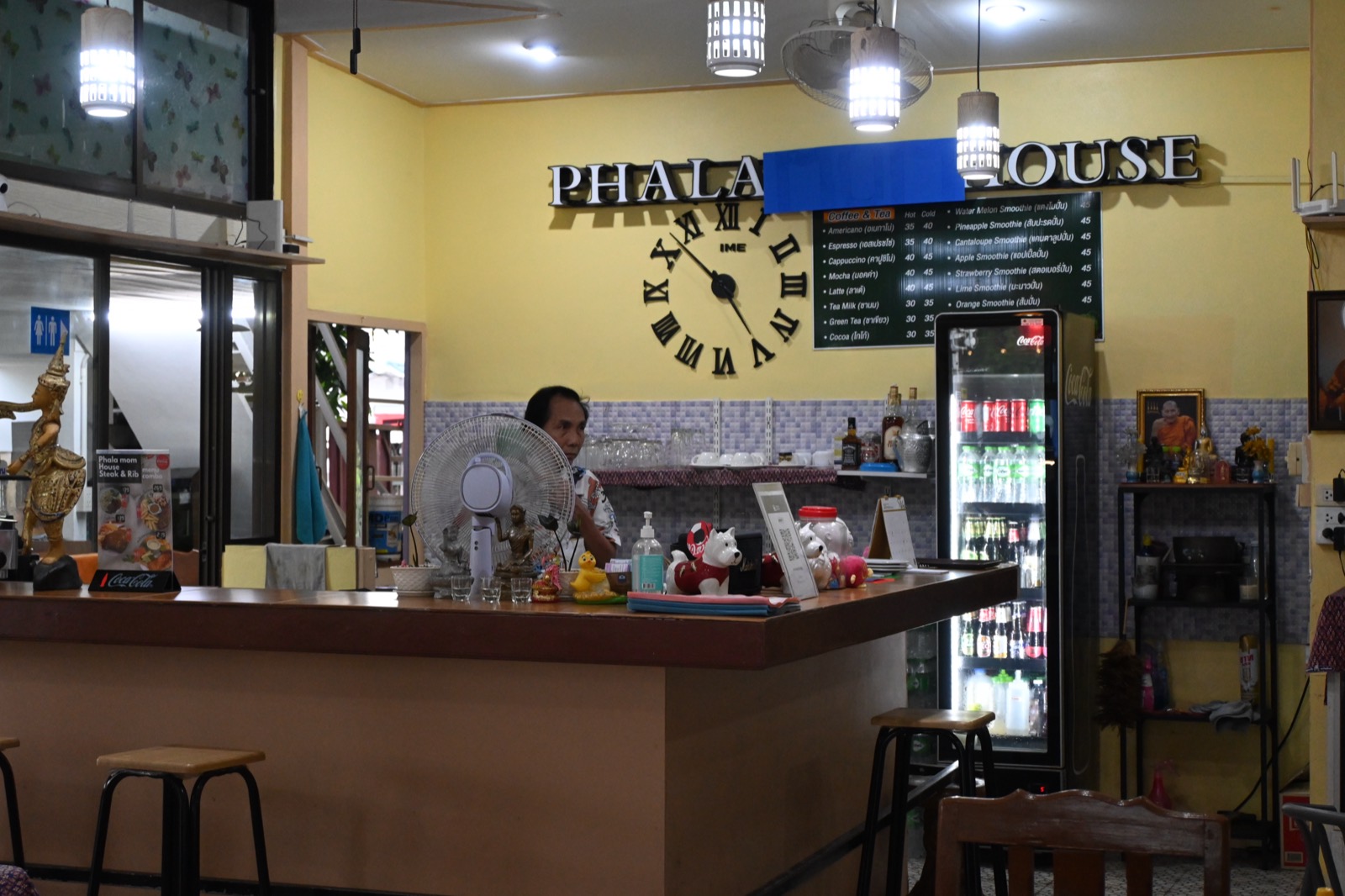 Interior of a small retail store with stocked shelves